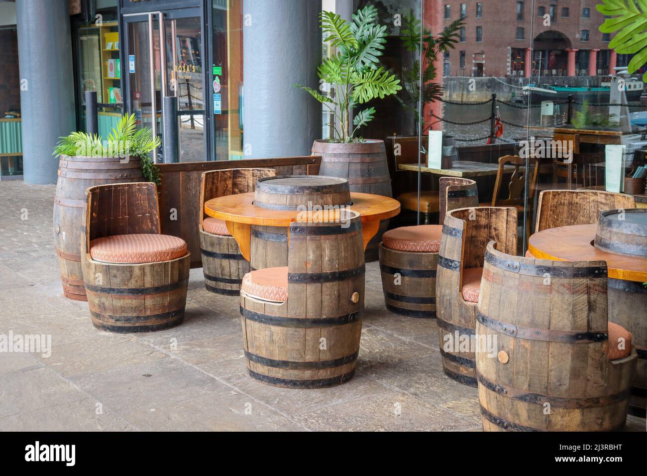 Outdoor seating, seats made from barrels, Albert Dock Liverpool Stock