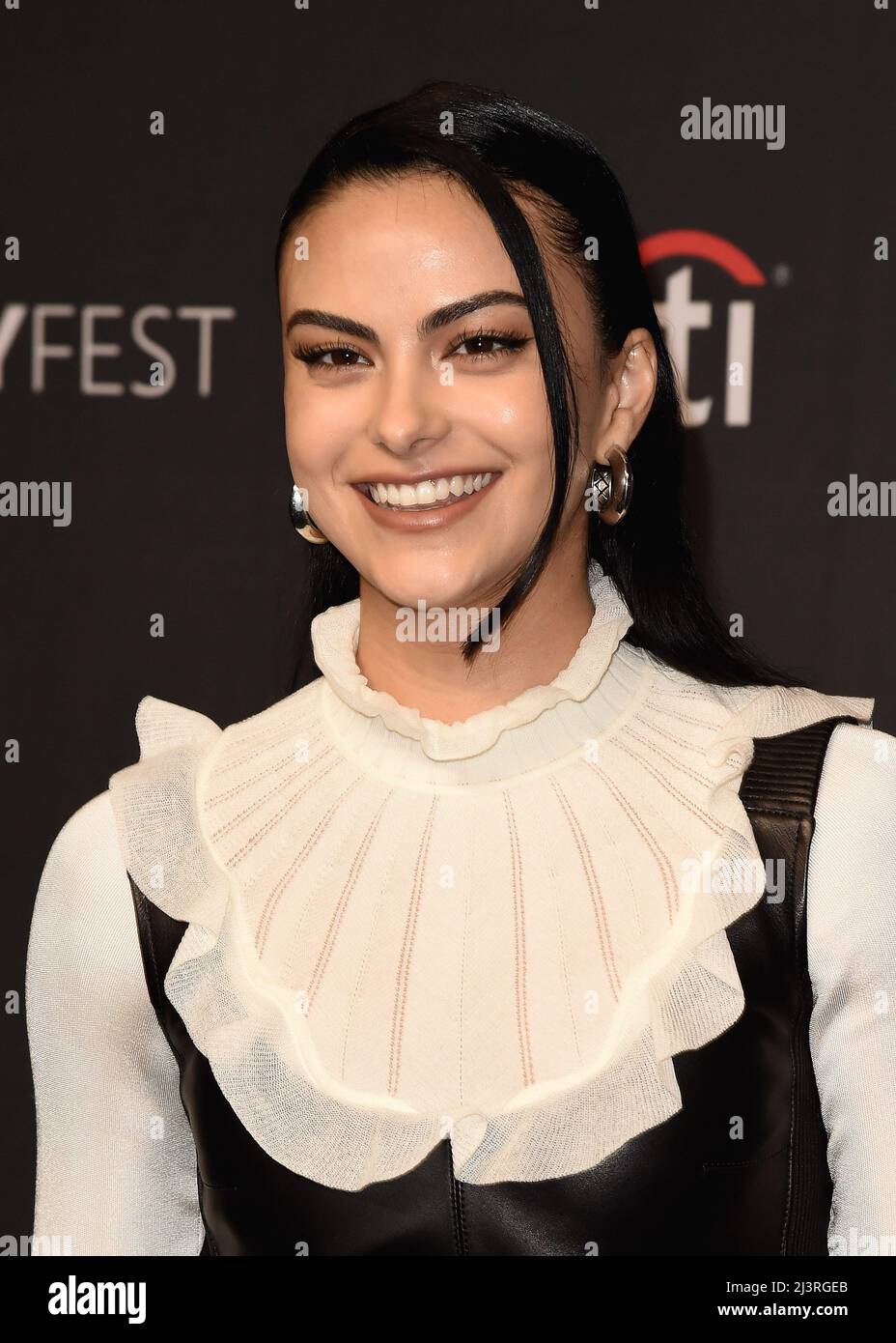 Camila Mendes walking on the red carpet at PaleyFest LA 2022