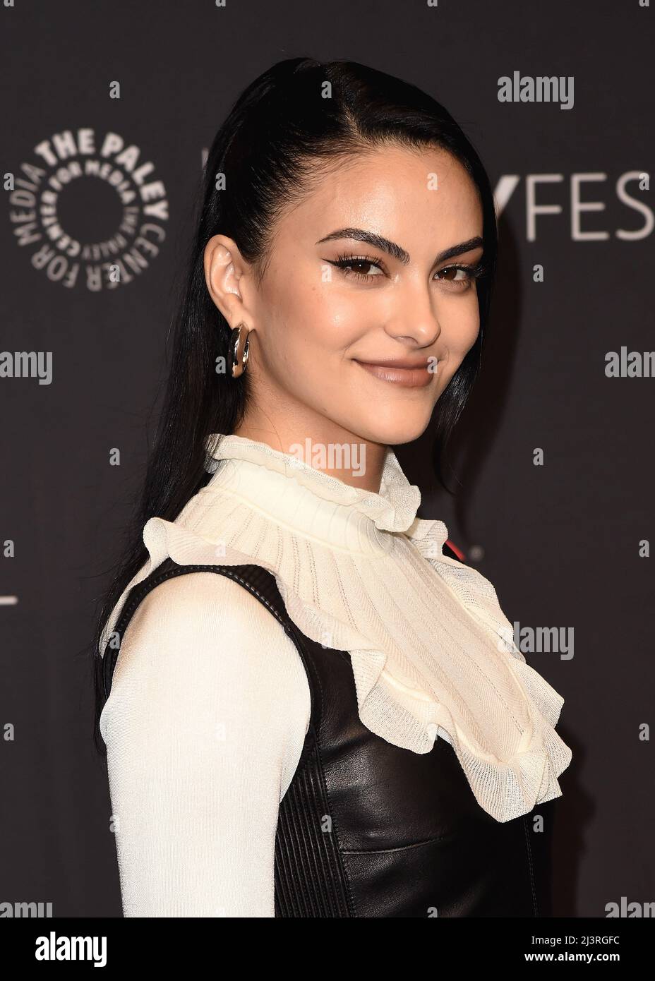 Camila Mendes walking on the red carpet at PaleyFest LA 2022