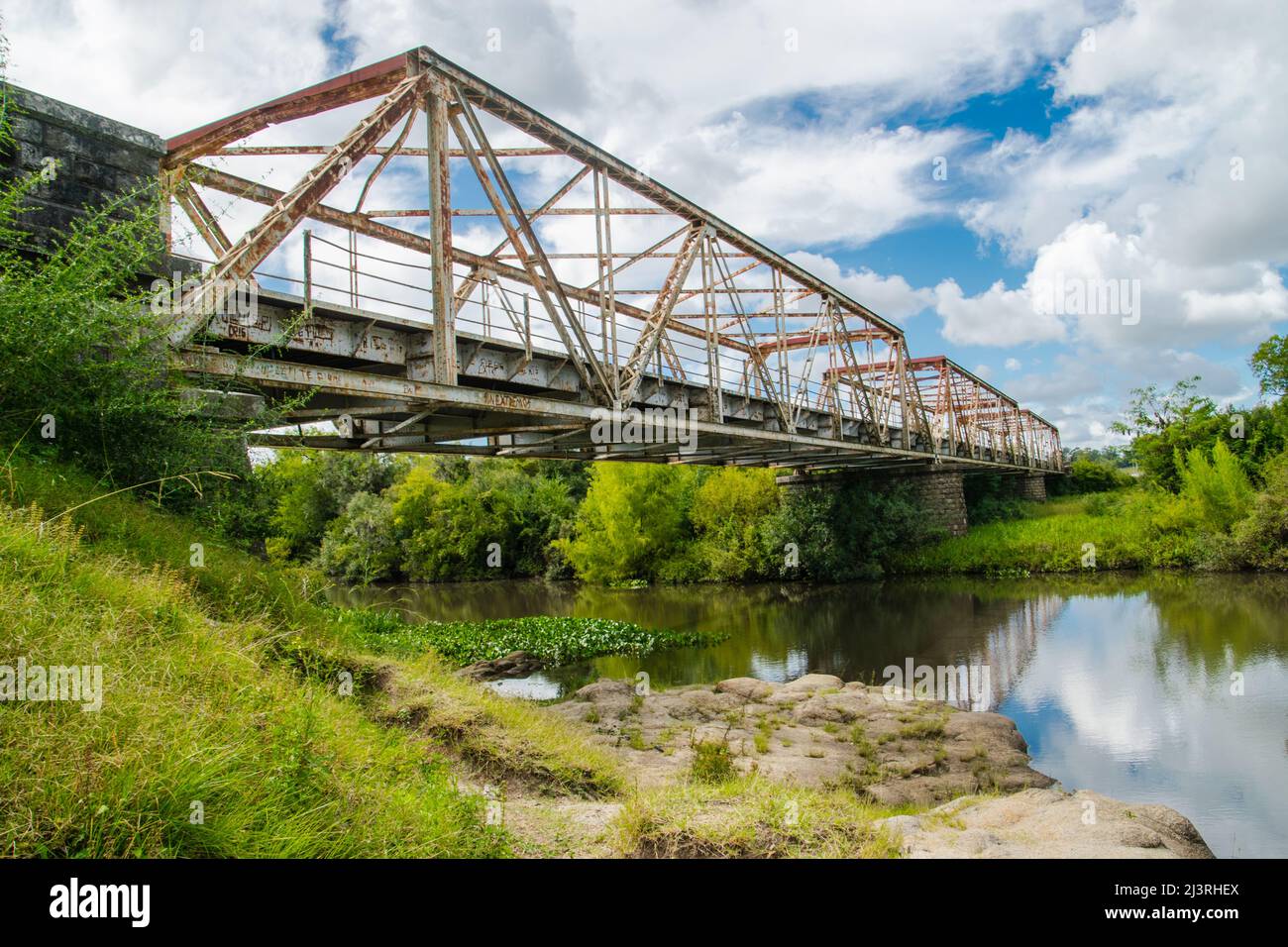 An old iron bridge over the river Stock Photo - Alamy