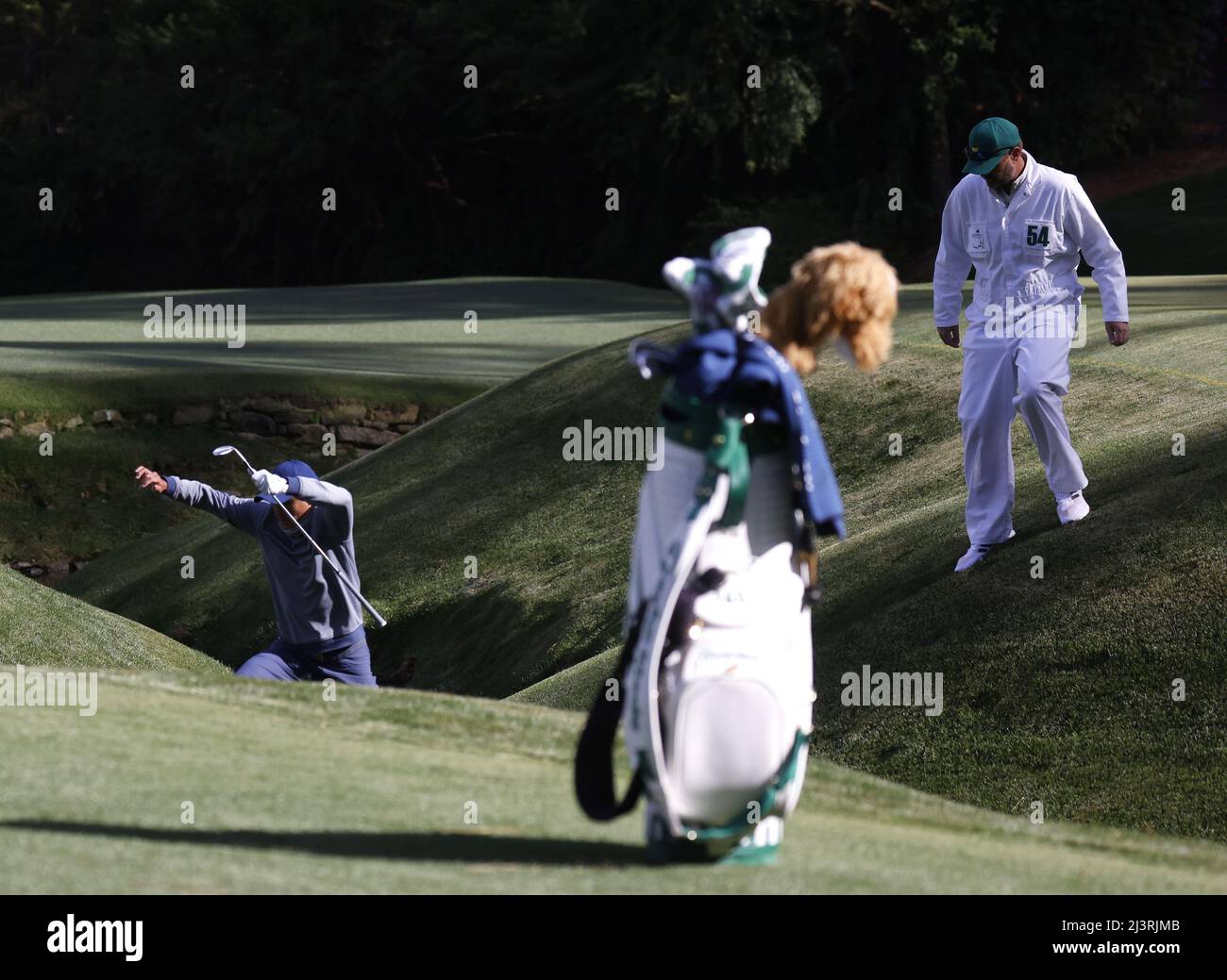Augusta, United States. 09th Apr, 2022. Collin Morikawa leaps over Raes Creek while preparing for a pitch shot to the 13th green in the third round of The Masters golf tournament at Augusta National Golf Club in Augusta, Georgia on Saturday, April 9, 2022. Photo by John Angelillo/UPI Credit: UPI/Alamy Live News Stock Photo