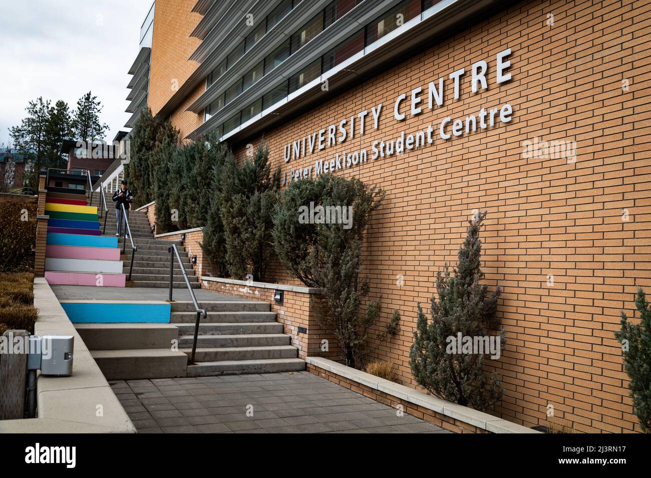 Photo of the Student Centre at the University of British Columbia, with painted 'Progress Pride' painted steps next to it. Stock Photo