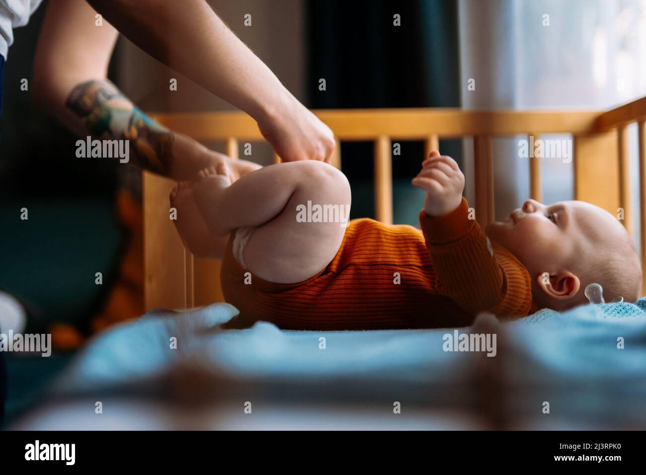 Mom changing baby diaper. 5 months Toddler Stock Photo Alamy