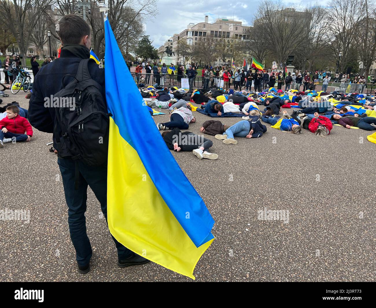 09 April 2022 Washington DC USA Supporters for Ukraine stage demonstration in front of The White house lying on the ground to simulate the dead as names of the dead were dead a!oud. Stock Photo