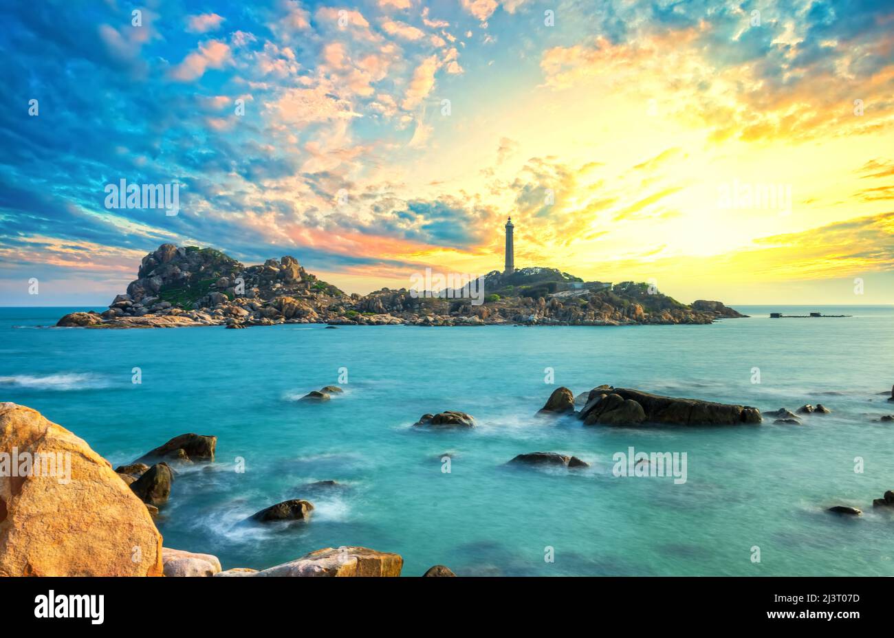 Lighthouse Only Image Landscape of the small island with the ancient lighthouse at sunset sky ...