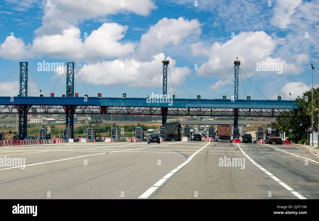 Morocco.  Approaching Toll Booth on Highway A-2, between Meknes and Rabat.  Storks Nests atop two Columns. Stock Photo