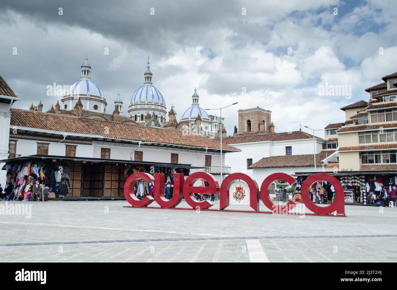 San Francisco Square in Cuenca. Cuenca welcome sign is seen on the right and the domes of Cathedral of Cuenca is seen in the distance Stock Photo