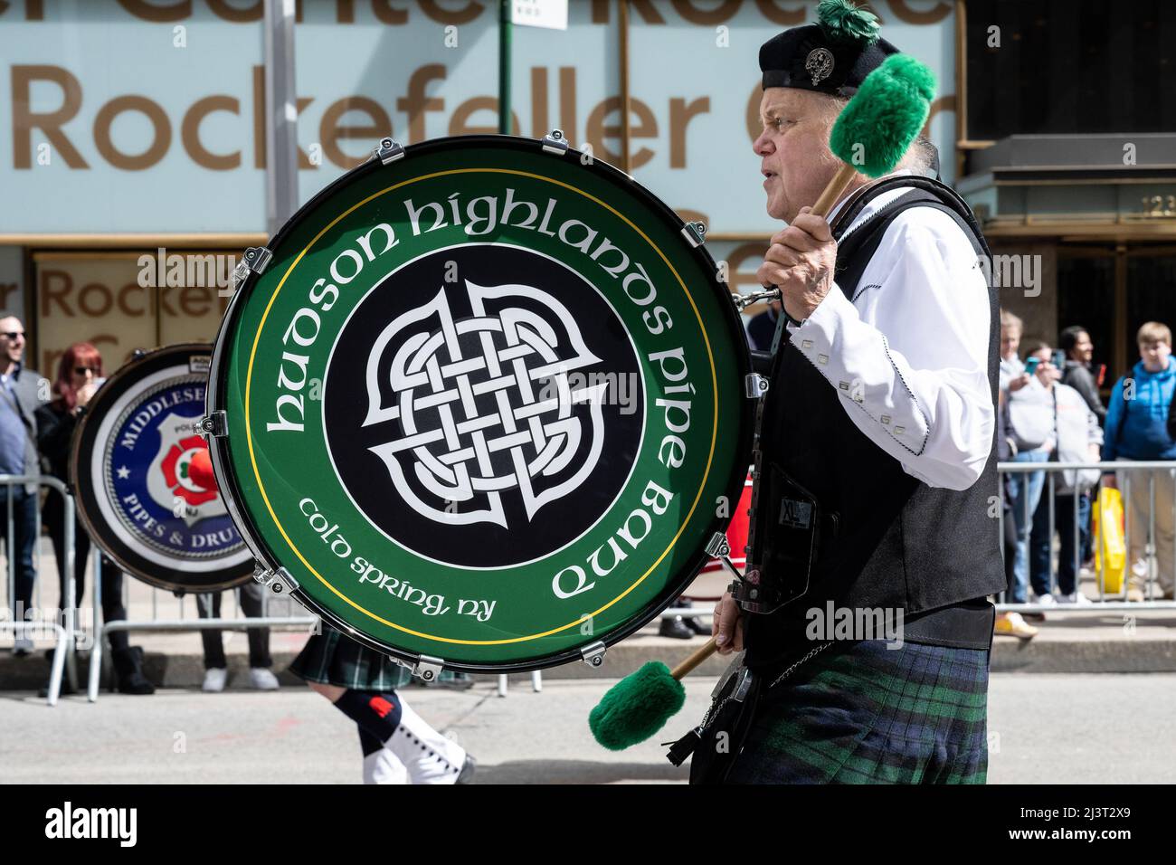 A bagpipe and drums band marches in the Tartan Day Parade in New York
