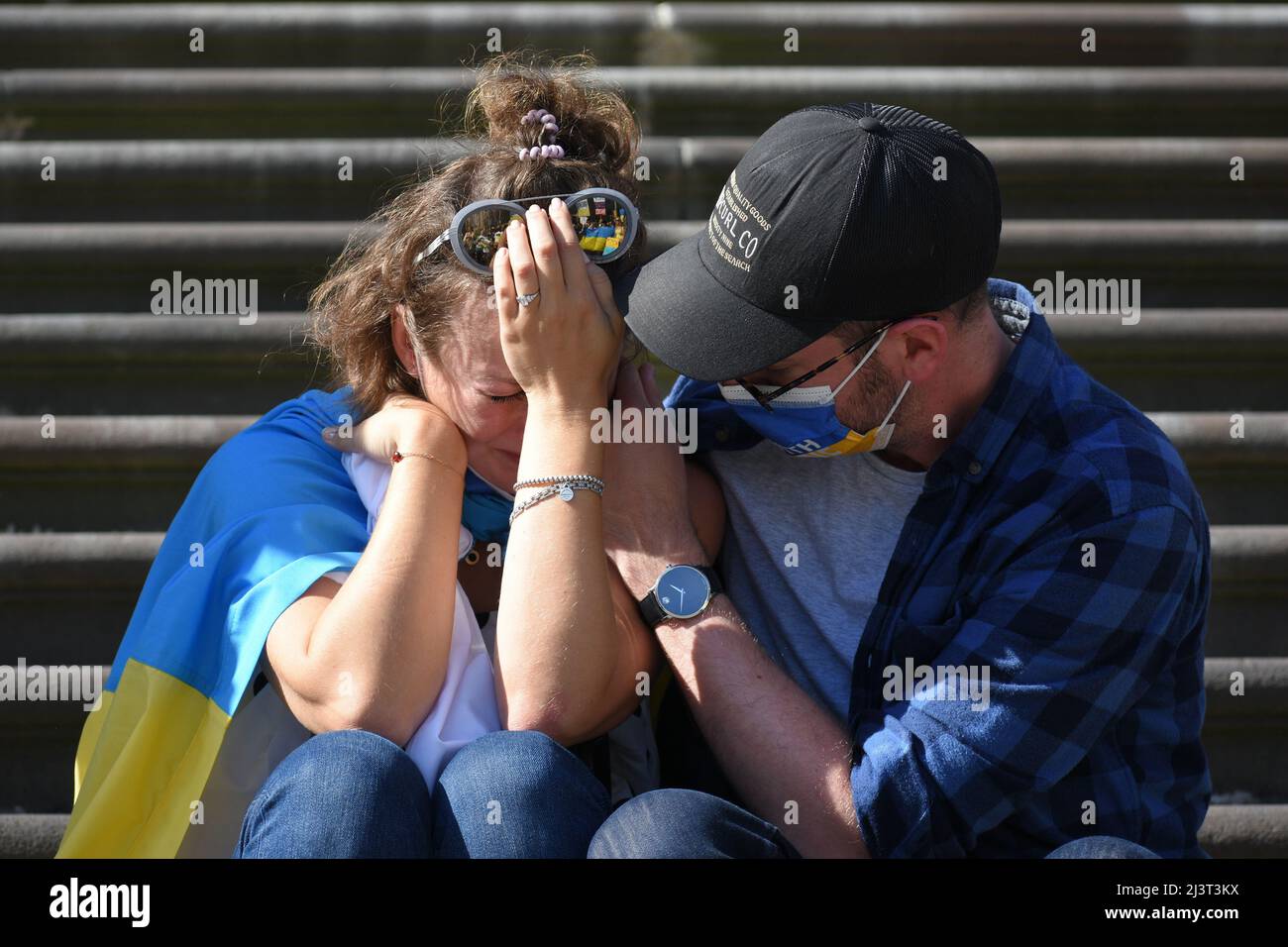 Melbourne, Australia. 10th Apr, 2022. A crying woman is comforted during a rally for peace in Ukraine in Melbourne. Credit: Jay Kogler/Alamy Live News Stock Photo