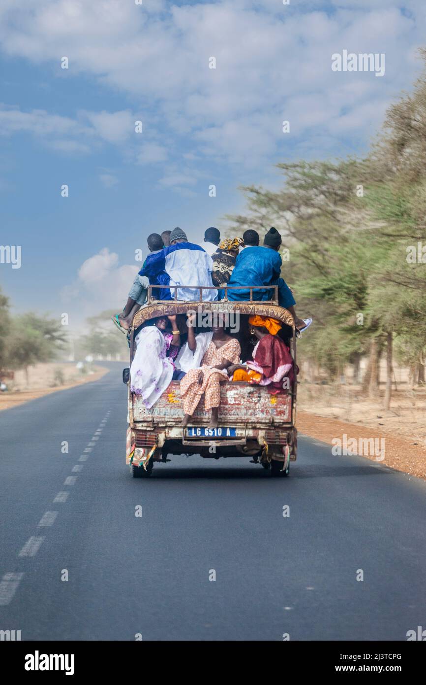 Senegal, Highway Safety.  Passengers Riding with no Seat Belts--or even no Seats. Stock Photo