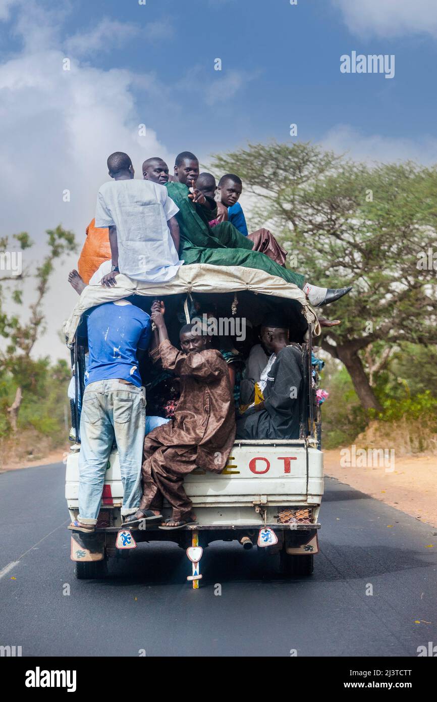 Senegal, Highway Safety.  Passengers Riding with no Seat Belts--or even no Seats. Stock Photo