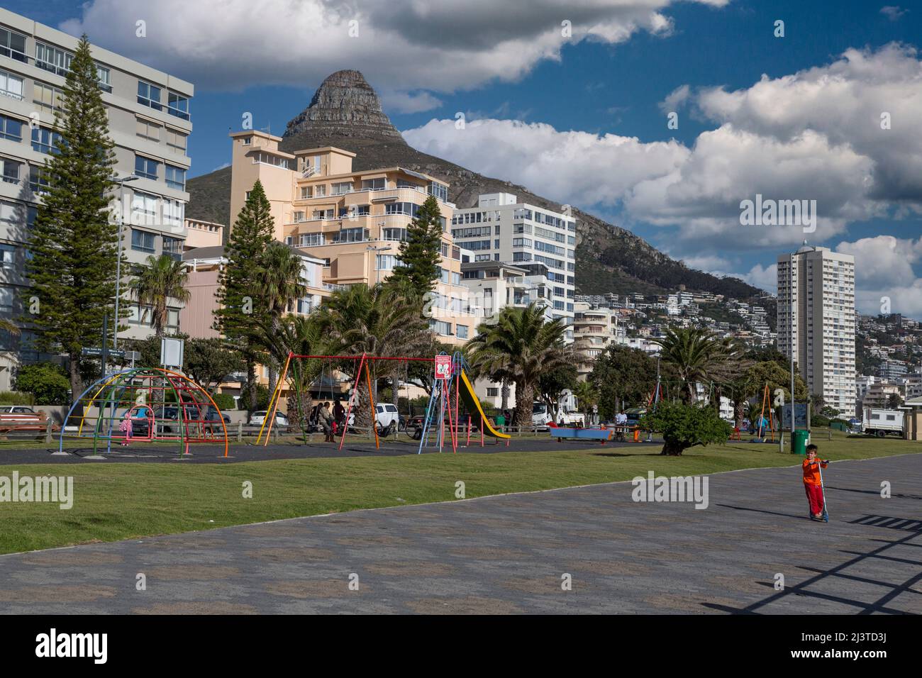 South Africa, Cape Town.  Children's Playground on the  Sea Point Promenade.  Lion's Head in the background. Stock Photo
