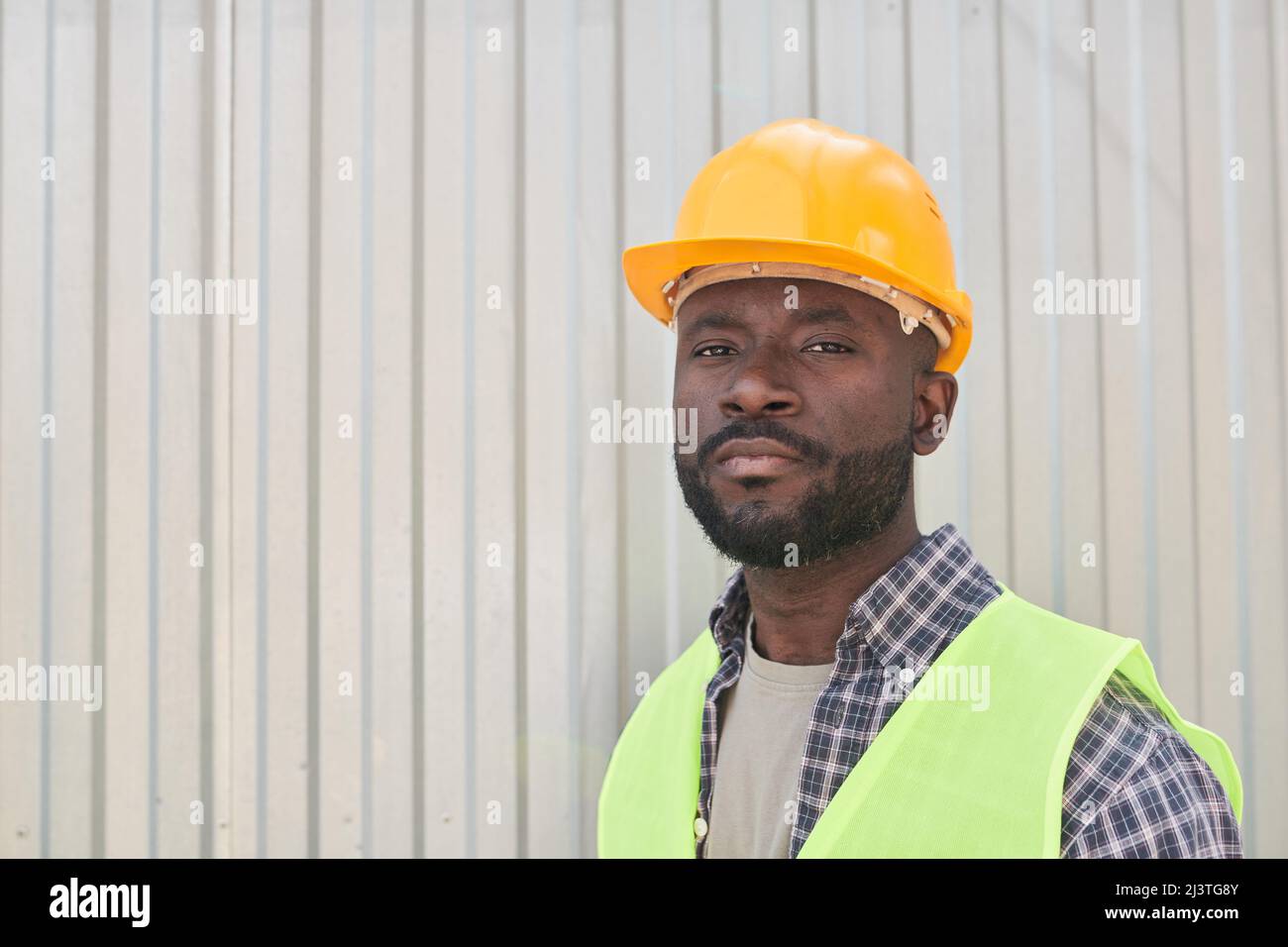 Man wearing hardhat standing hi-res stock photography and images