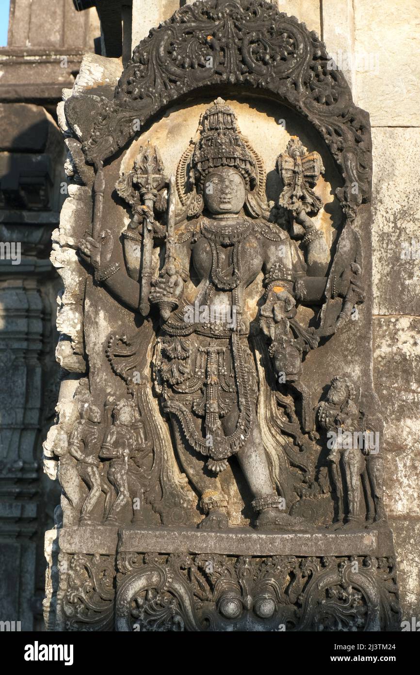 Stone Sculpture of Beautiful Female (Madanikas) with selective focus, 12th century Hindu temple, Ancient stone art and sculptures in each pillars, Che Stock Photo