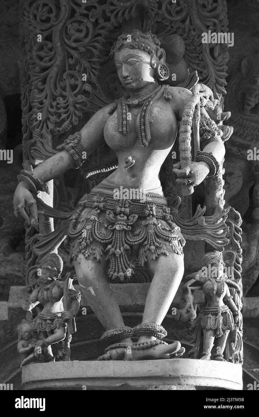 Stone Sculpture of Beautiful Female (Madanikas) with selective focus, 12th century Hindu temple