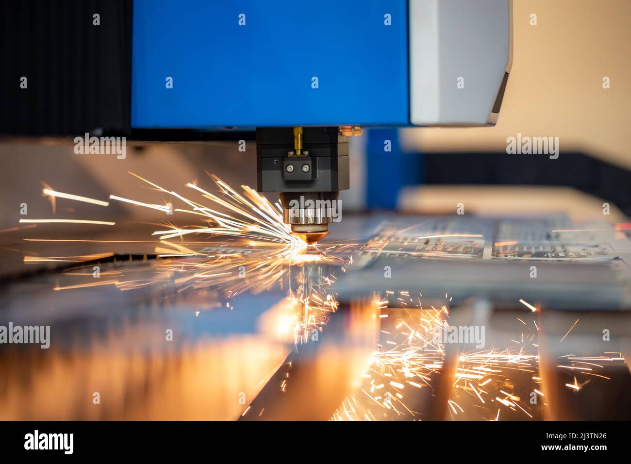 CNC Laser cutting of metal, modern industrial technology Making Industrial Details. The laser optics and CNC (computer numerical control) are used to Stock Photo