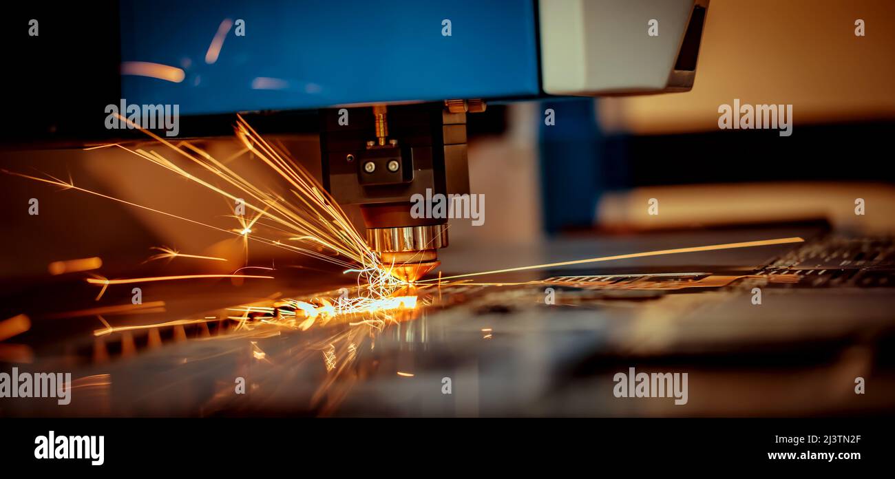 CNC Laser cutting of metal, modern industrial technology Making Industrial Details. The laser optics and CNC (computer numerical control) are used to Stock Photo