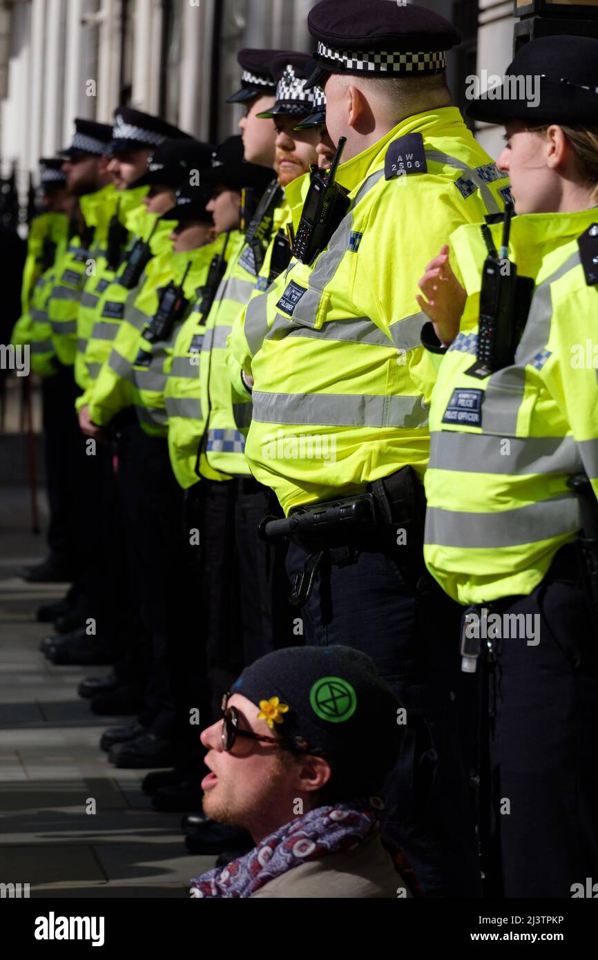 London, UK. 9th Apr, 2022. Extinction Rebellion (XR) activists gathered in Hyde Park and marched through Oxford Street making a stop in Oxford Circus, St James Square where BP is headquartered and finally to Trafalgar Square where traffic was blocked. Today was part of a week long wave of protests and civil disobedience actions to demand an immediate stop to all new fossil fuel infrastructure by the British government amid the climate crisis and ecological emergency. Stock Photo