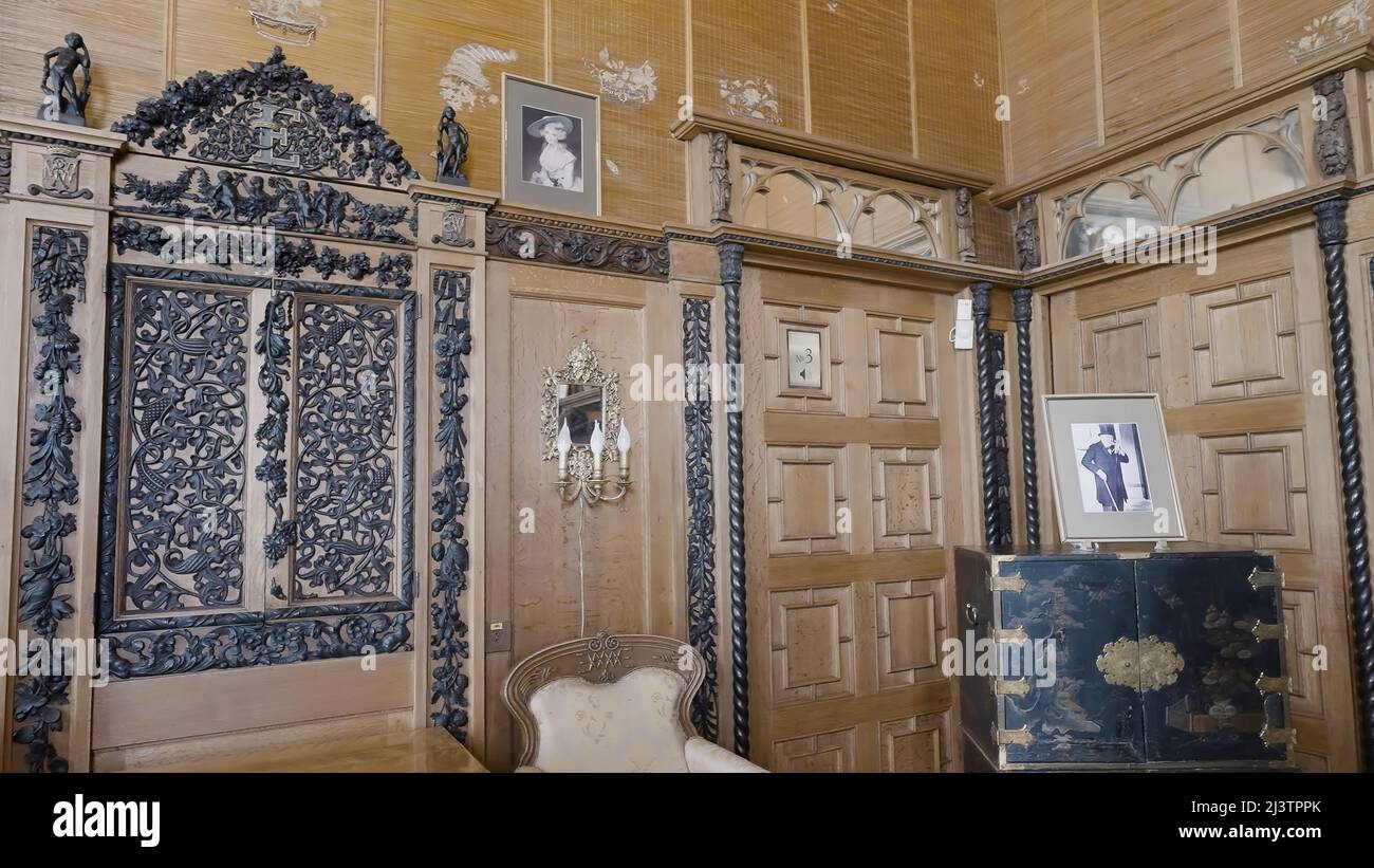 Wooden beautiful old fashioned walls with carved inserts, candle ...