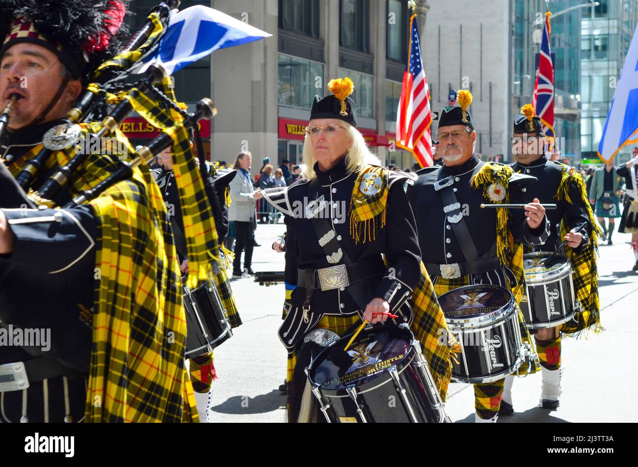 Marching band during the world's largest pipe and drum parade to celebrate Scottish Tartan Day