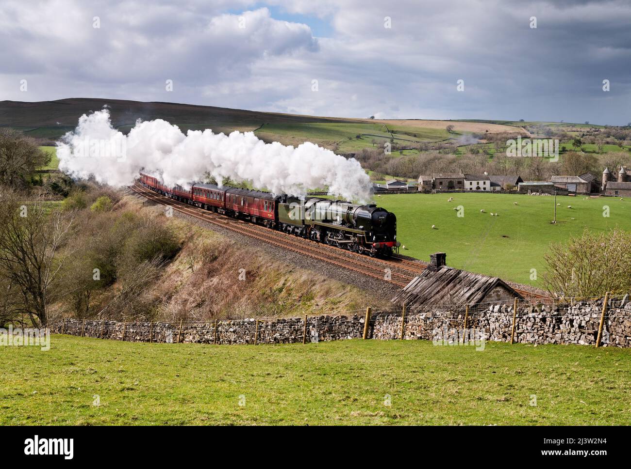 Steam locomotive 'British India Line' hauls a special train southward on the Settle-Carlisle railway line, passing Smardale, near Kirkby Stephen,. Stock Photo