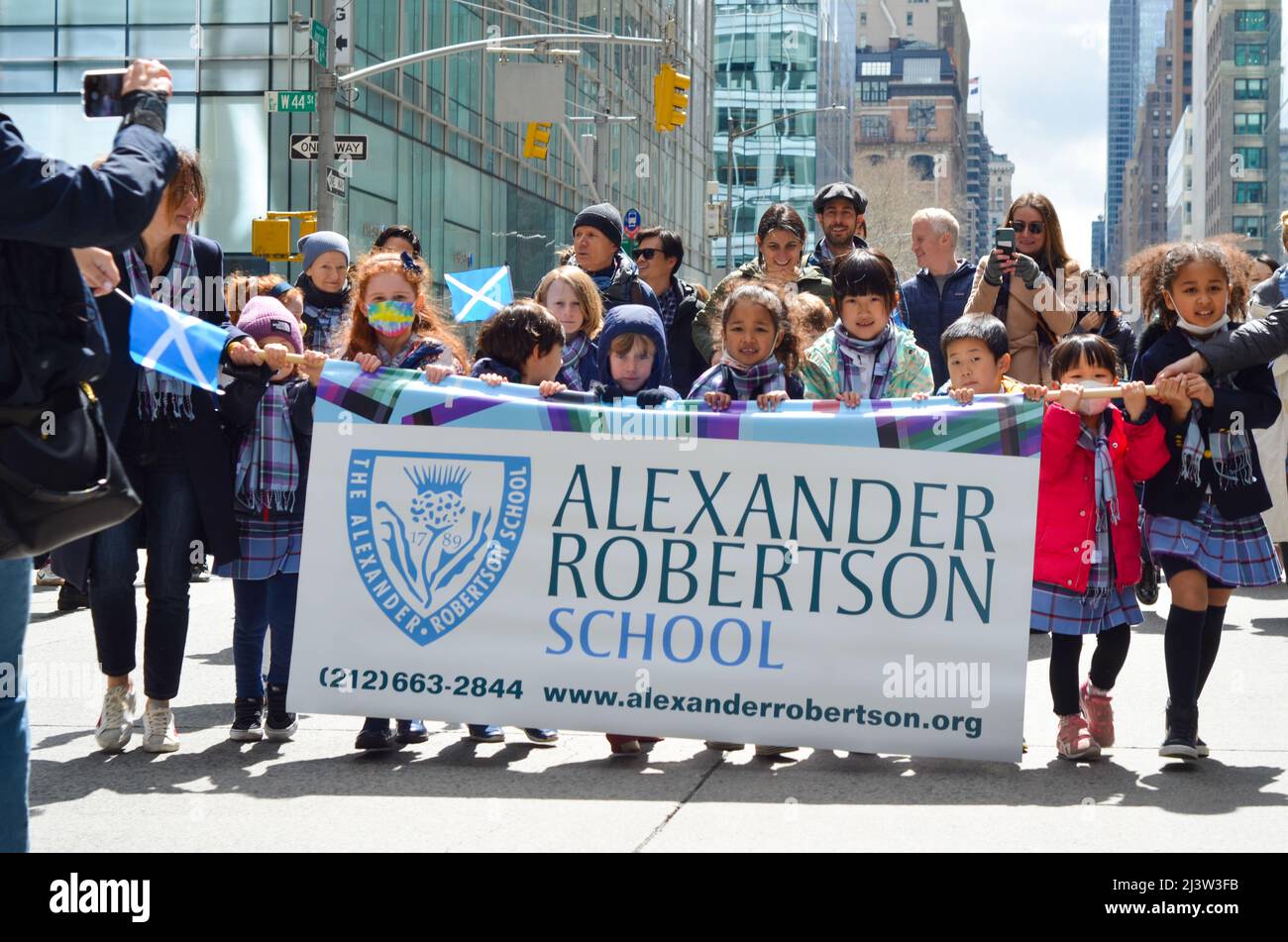 April 9, 2022, New York, New York, United States: Young participants of Alexander Robertson School march up Sixth Avenue during the world's largest pipe and drum parade to celebrate Scottish Tartan Day on April 9, 2022 in New York City. (Credit Image: © Ryan Rahman/Pacific Press via ZUMA Press Wire) Stock Photo