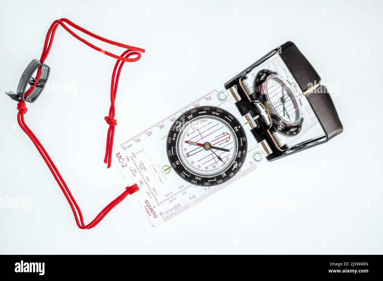 Mirror or sighting compass with red string Stock Photo Alamy