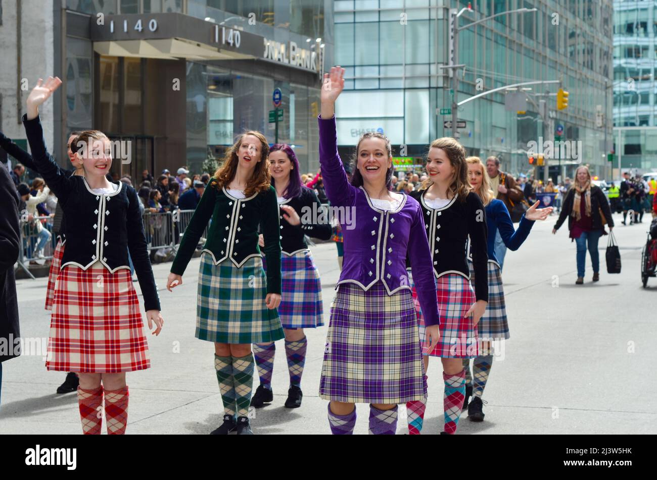 New York, New York, USA. 9th Apr, 2022. Marchers are seen waving hands on Sixth Avenue during the world's largest pipe and drum parade to celebrate Scottish Tartan Day on April 9, 2022 in New York City. (Credit Image: © Ryan Rahman/Pacific Press via ZUMA Press Wire) Stock Photo