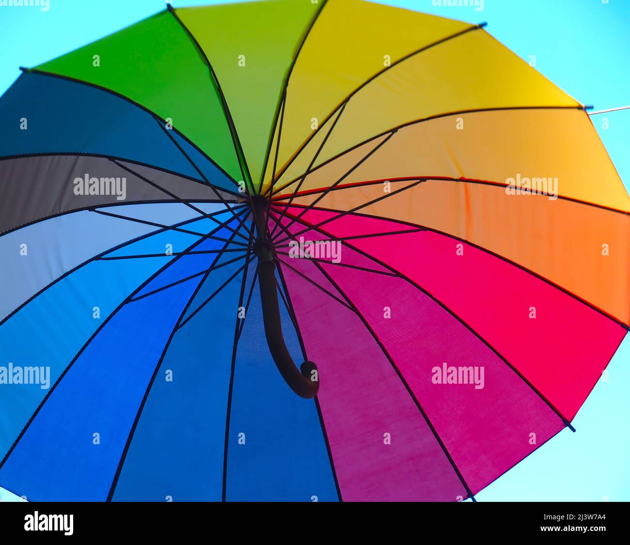 Isolated opened umbrella in rainbow colours Stock Photo