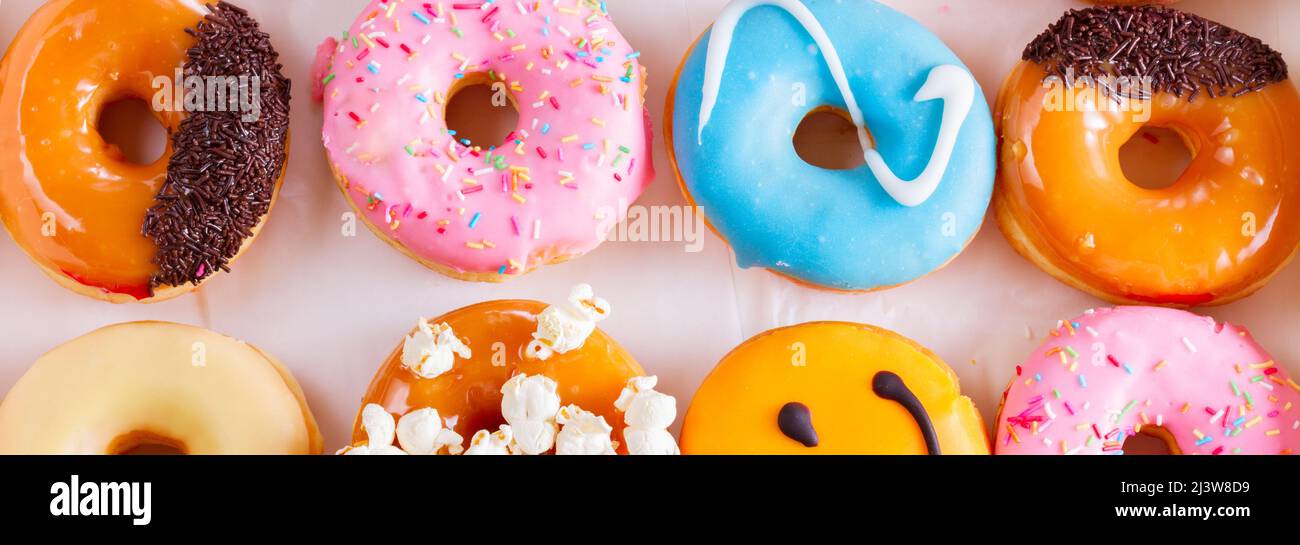 sweet doughnuts on gray stone background Stock Photo
