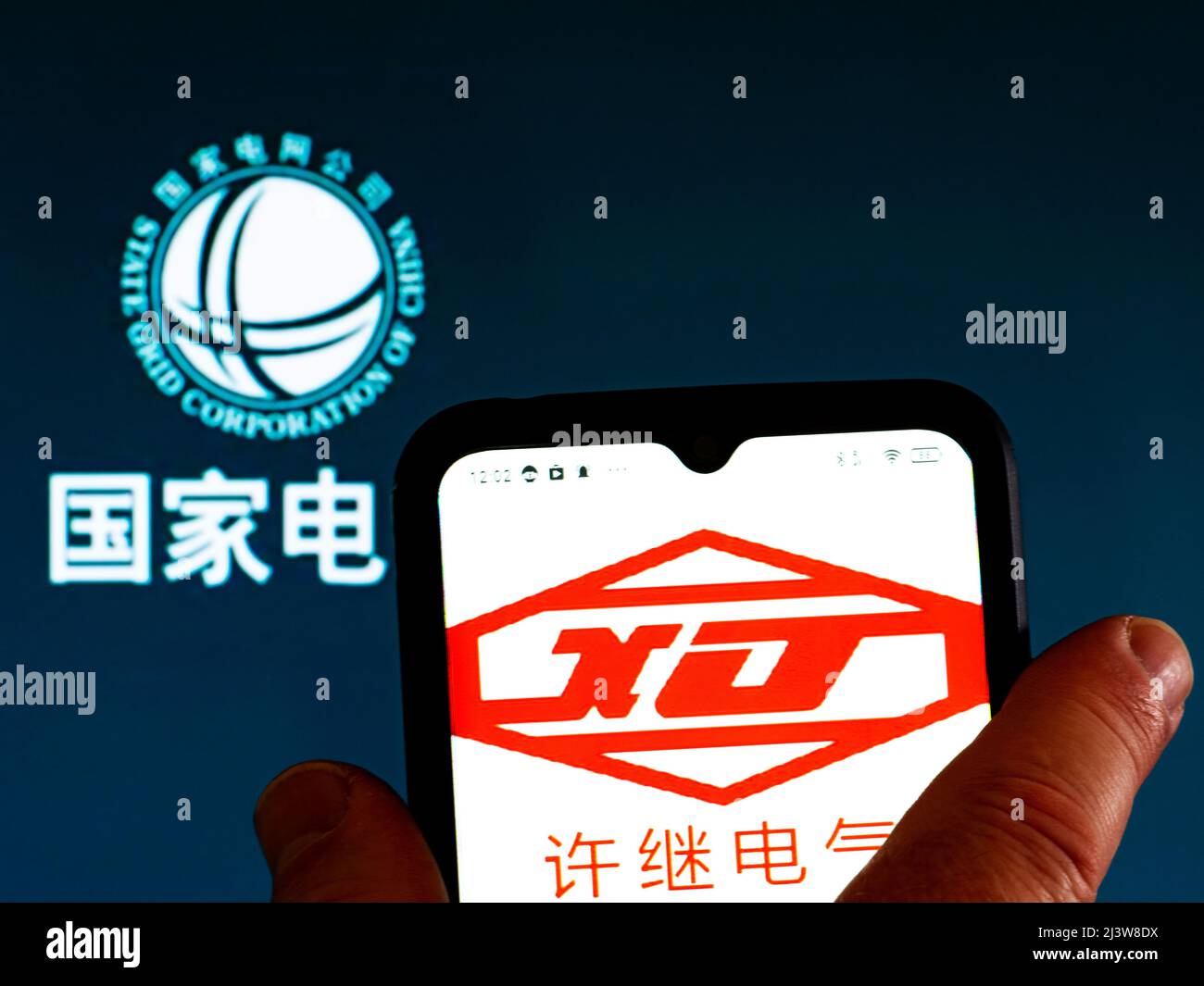 In this photo illustration, the XJ Group Corporation logo is displayed ...