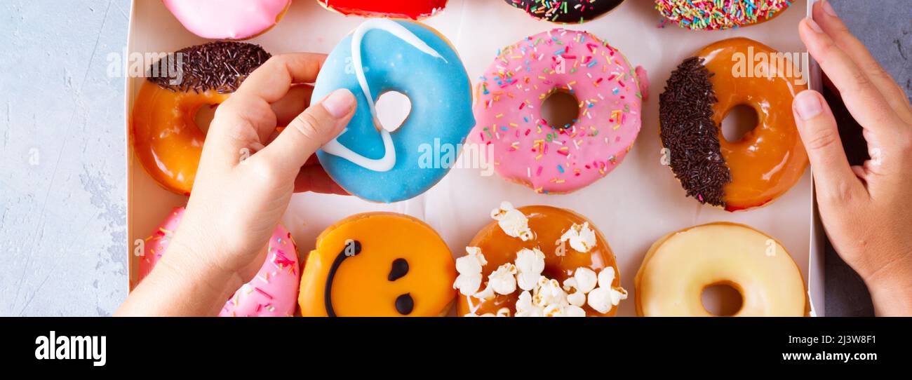 sweet doughnuts on gray stone background Stock Photo