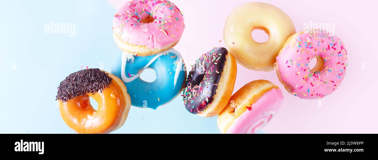 flying doughnuts on blue Stock Photo