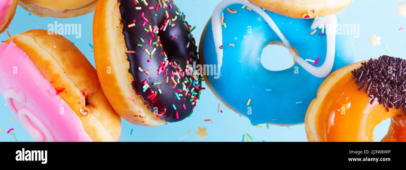 flying doughnuts on blue Stock Photo