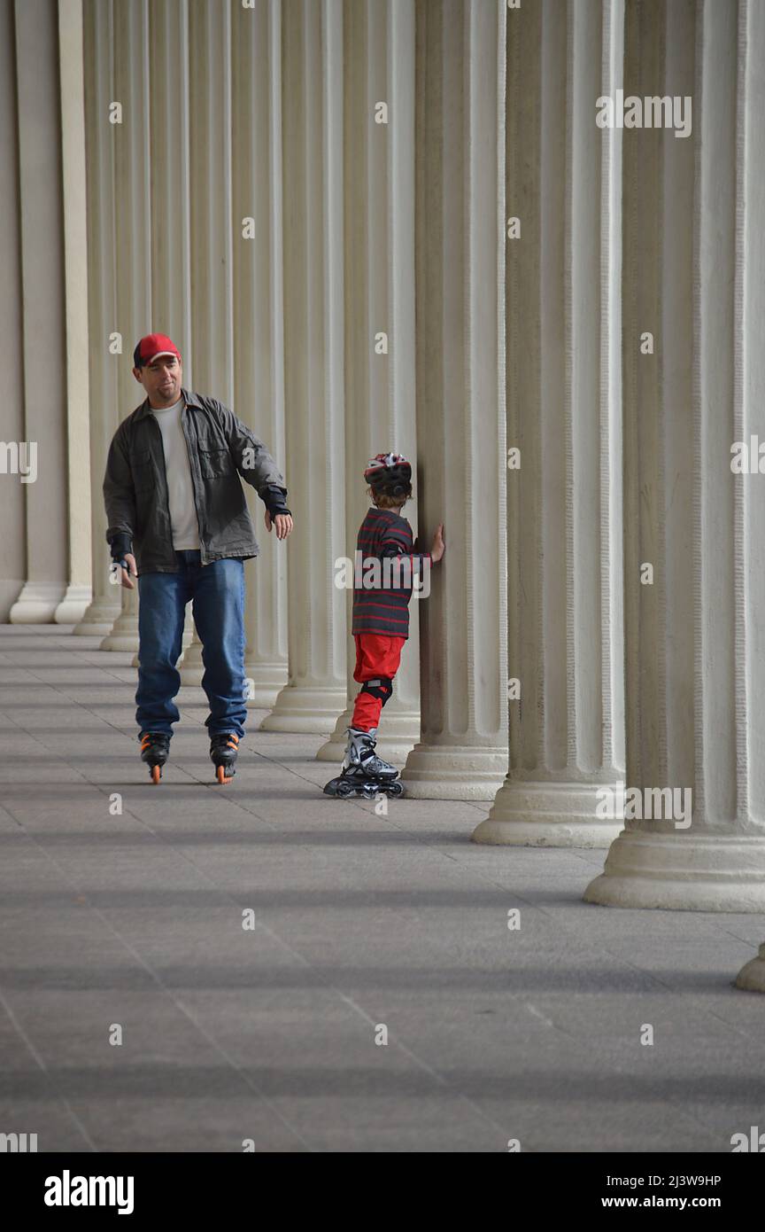 father and son skating Stock Photo