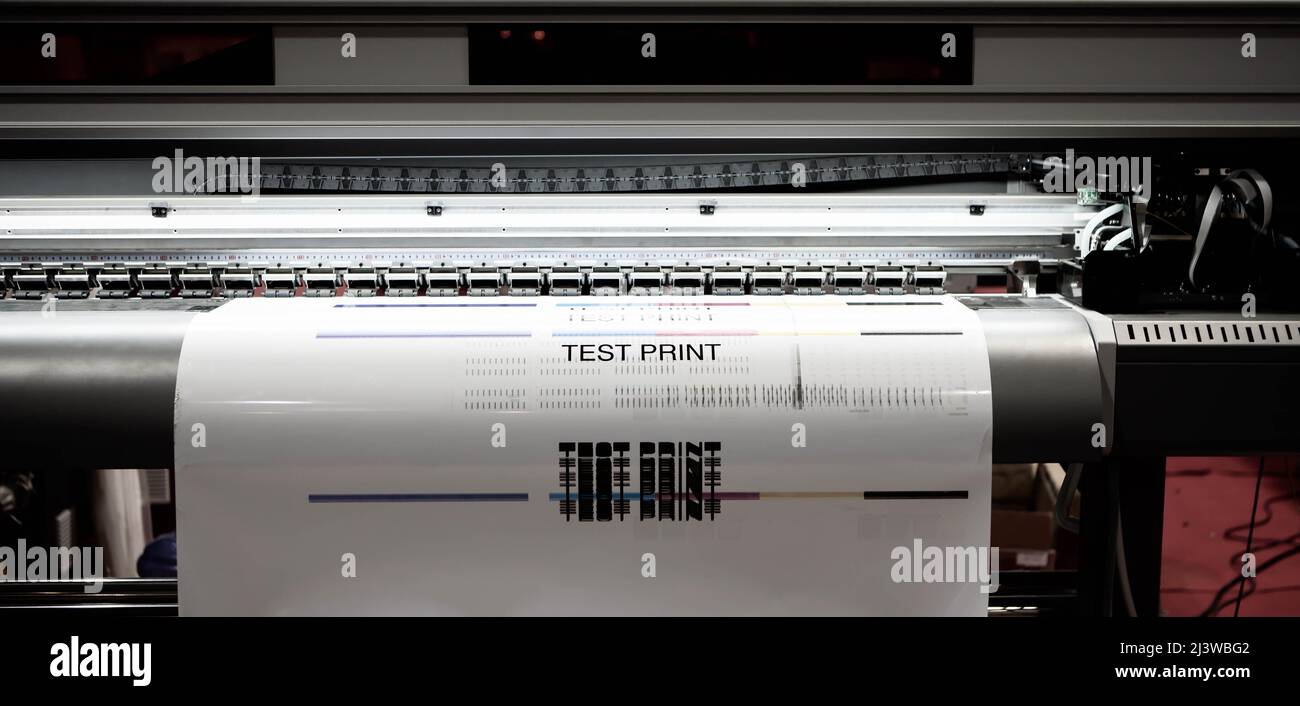 Large format digital printer. Test printing inkjet printer. Printing industry. Stock Photo