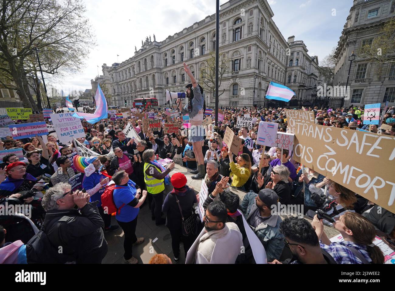People take part in a demonstration outside Downing Street in London, to protest against the exclusion of transgender people from a ban on conversion therapy. Picture date: Sunday April 10, 2022. Stock Photo