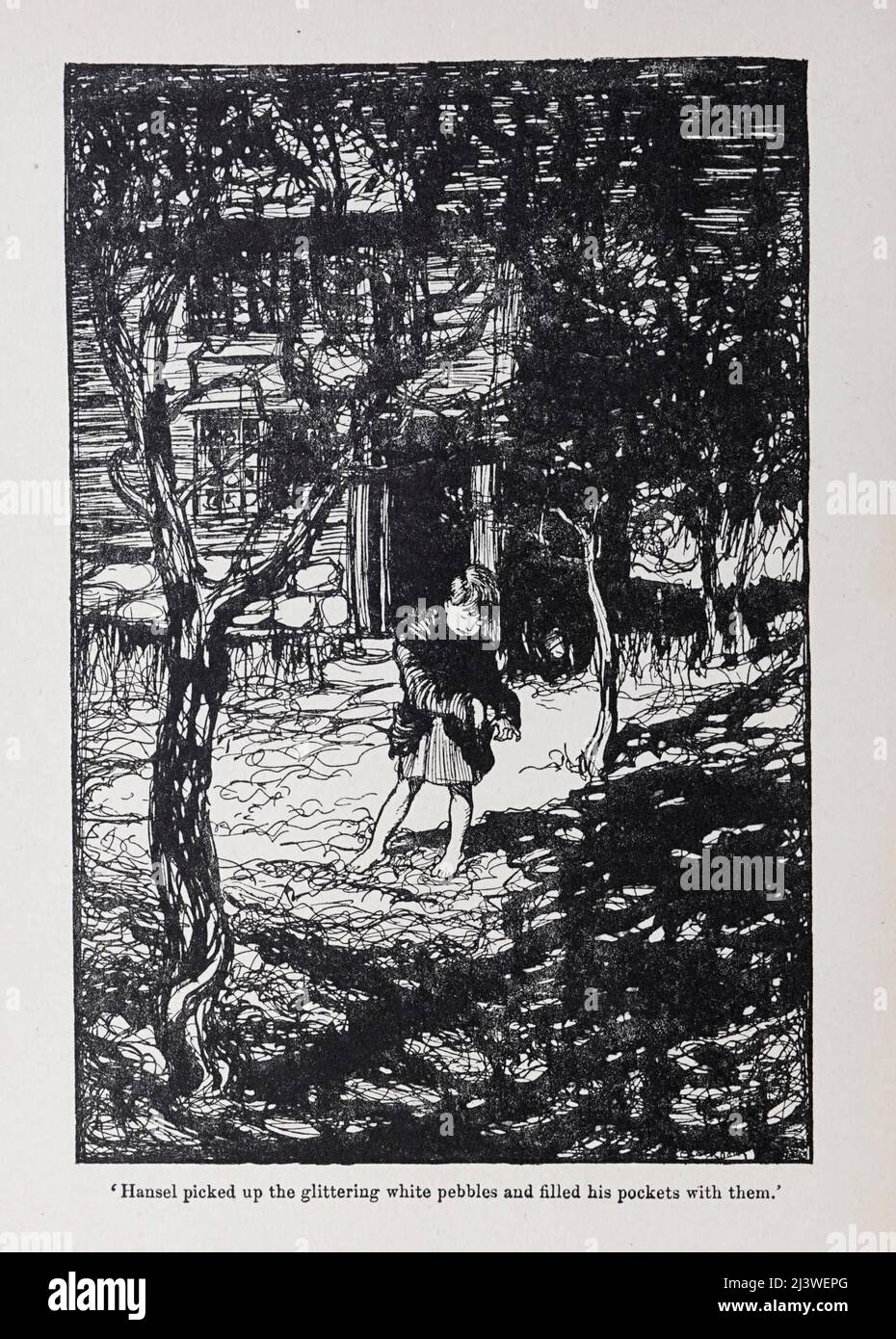 Hansel picked up the glittering white pebbles and filled his pockets with them from the book ' Hansel & Grethel : & other tales ' by Jacob Grimm, Wilhelm Grimm, Illustrated by Arthur Rackham, Publisher London : Constable & Co., Ltd 1920 Stock Photo