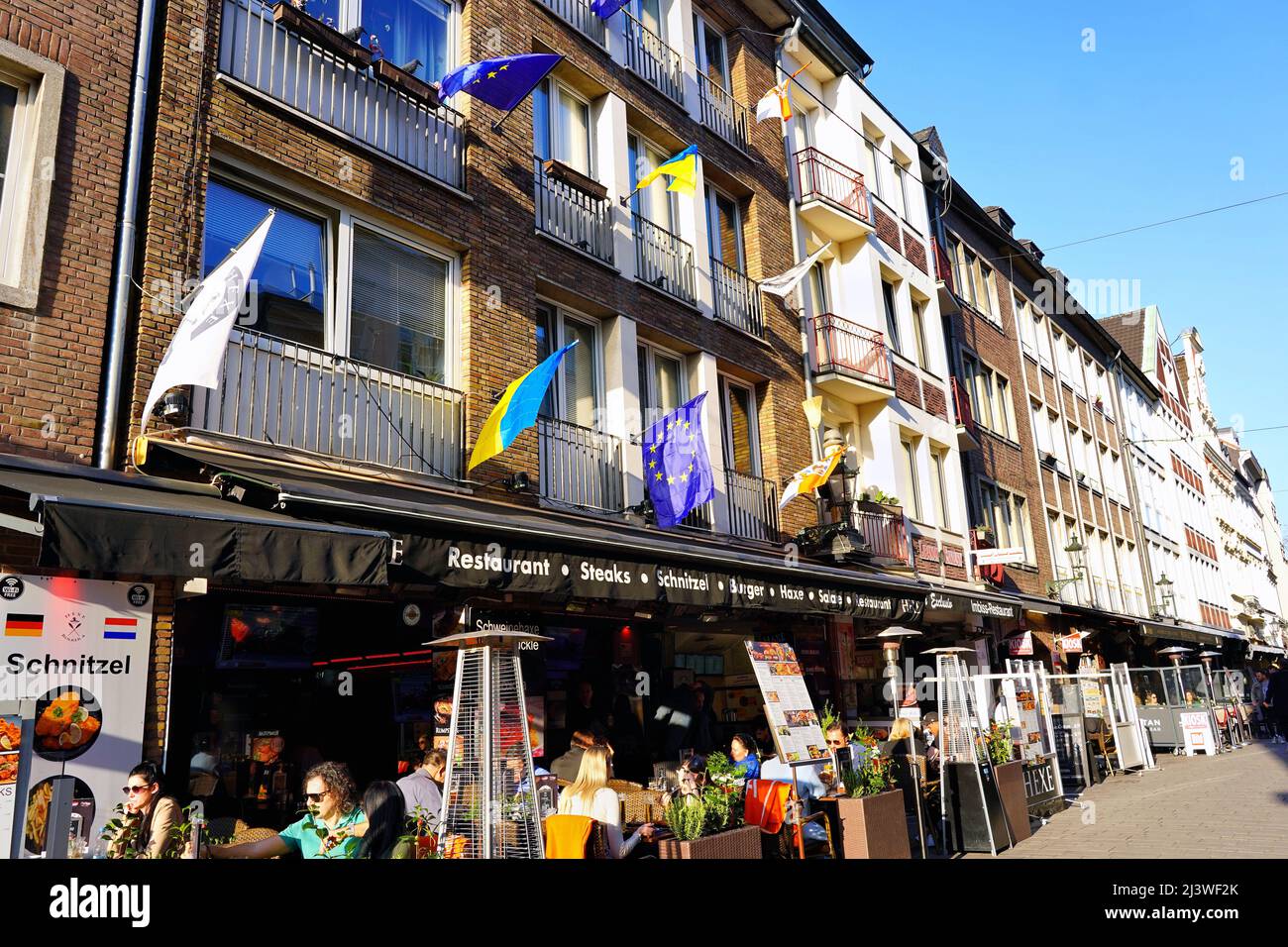 Düsseldorf Old Town with Ukraine flags and EU flags outside a