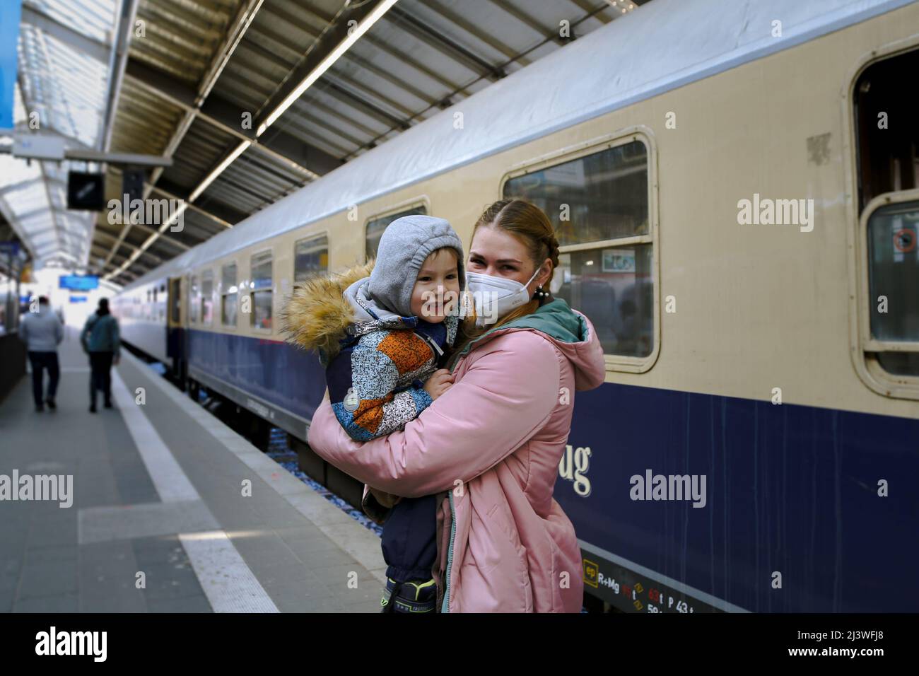 Refugee ukrainian Mother with her child on the German-Polish Border to travel on to Hannover Stock Photo