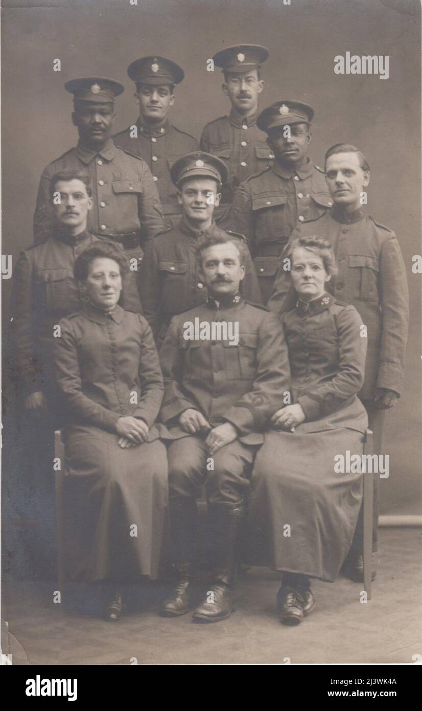 Portrait of members of the Salvation Army with soldiers, including two men of the British West Indies Regiment (BWIR), photographed during the First World War. The photo was taken by Caudevelle, photographer, Boulogne sur Mer, France. The BWIR was formed in 1915 from Caribbean volunteers in Britain. Stock Photo