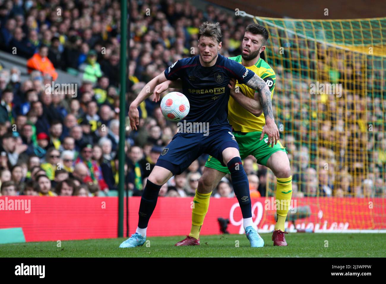 Wout Weghorst #9 of Burnley holds the ball up under pressure from Grant Hanley #5 of Norwich City Stock Photo