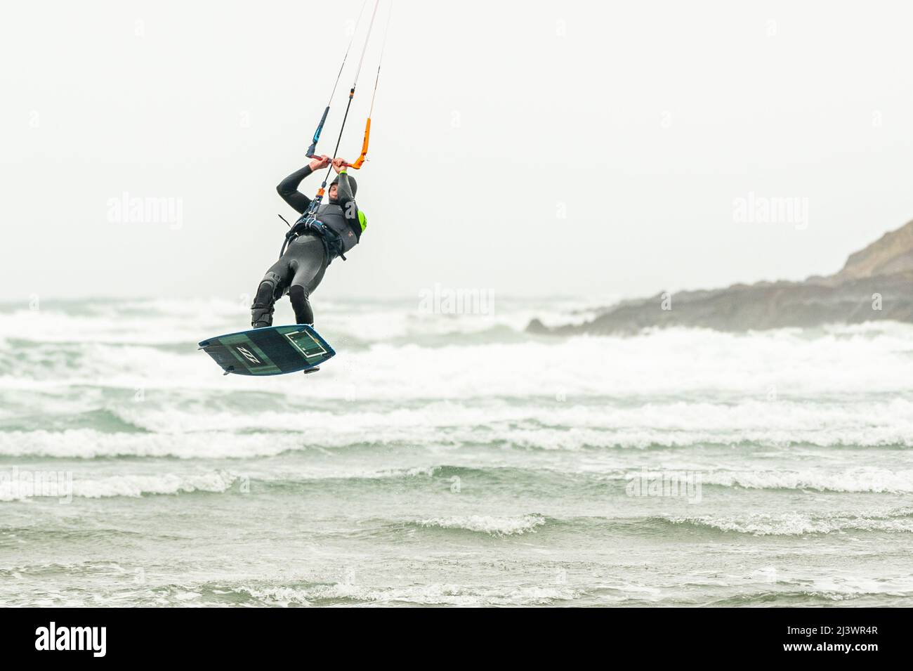 Inchydoney, West Cork, Ireland. 10th Apr, 2022. Kite surfers make the most of the gale force winds at Inchydoney Beach this afternoon. The rest of the day will be dull with rain showers and highs of 8-12C. Credit: AG News/Alamy Live News Stock Photo