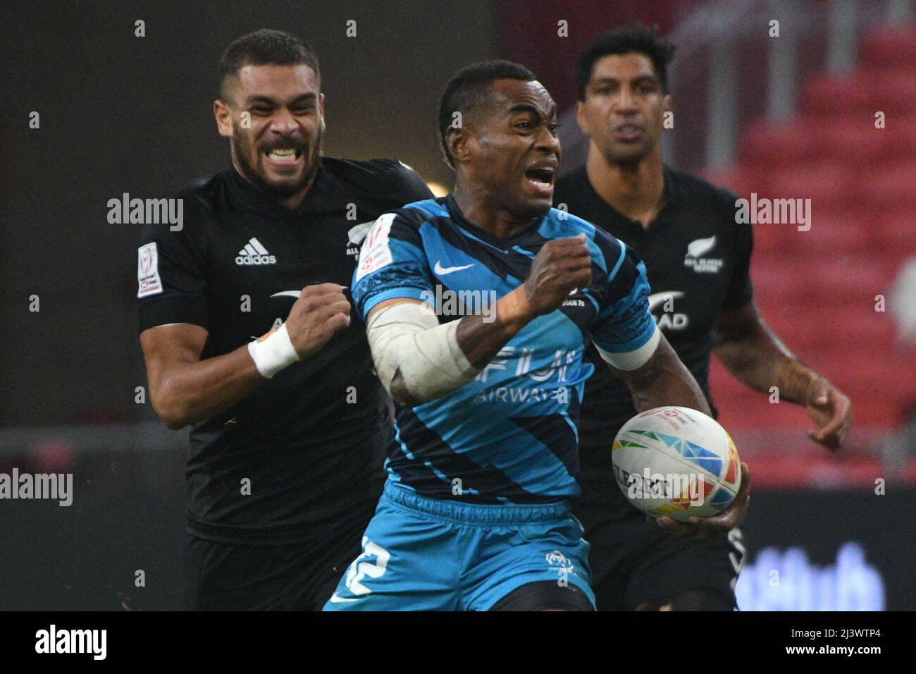 Singapore. 10th Apr, 2022. Vuiviawa Naduvalo (C) of Fiji competes during the final between New Zealand and Fiji at the HSBC World Rugby Sevens Singapore stop, held in the National Stadium on April 10, 2022. Credit: Then Chih Wey/Xinhua/Alamy Live News Stock Photo