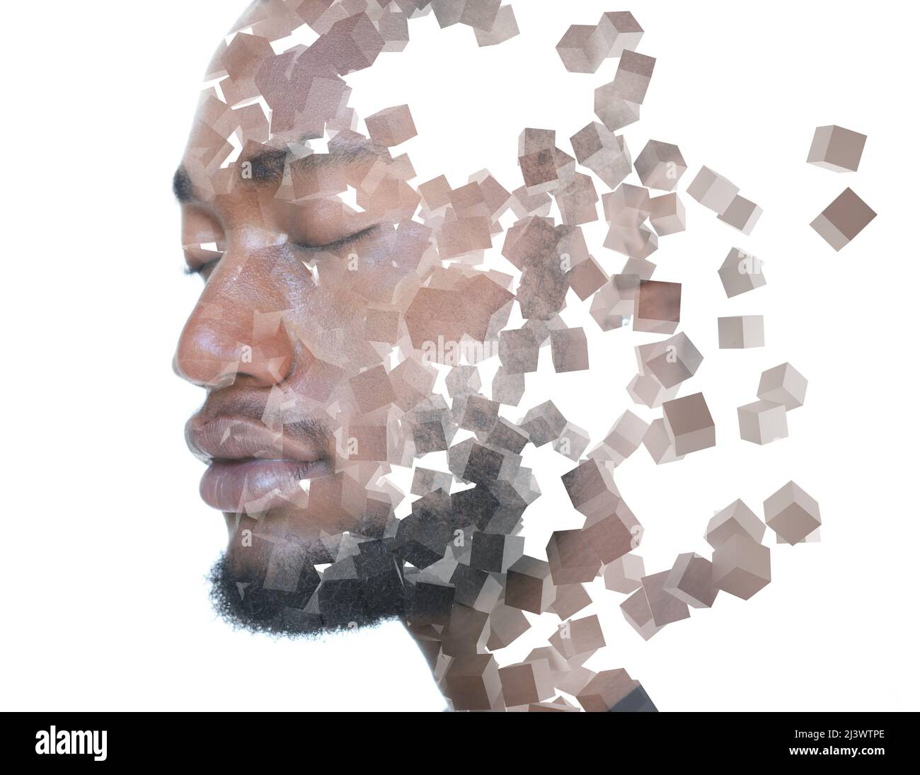 Multiple cubes floating in the air combined with a portrait of a young man Stock Photo