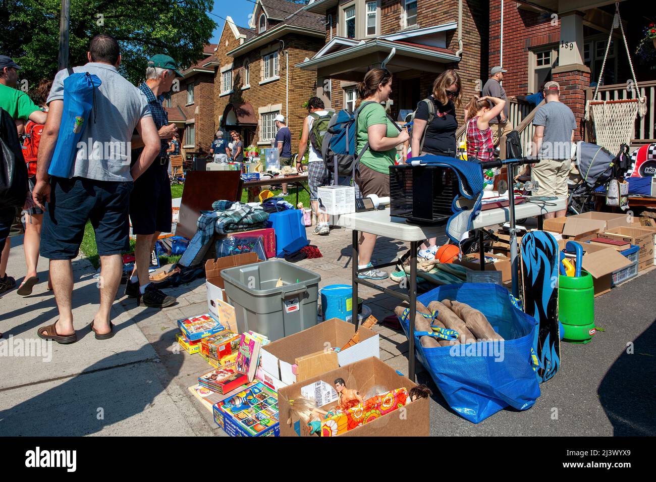 Ottawa, Canada – May 26, 2012;  Thousands of people gather at the annual Glebe neighborhood garage sale which takes place for several blocks Stock Photo
