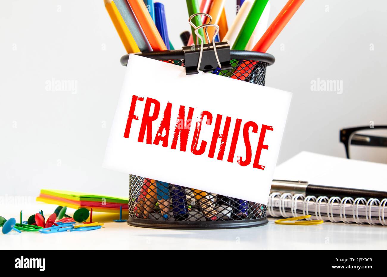 Word franchise on white sticker with yellow background Stock Photo - Alamy