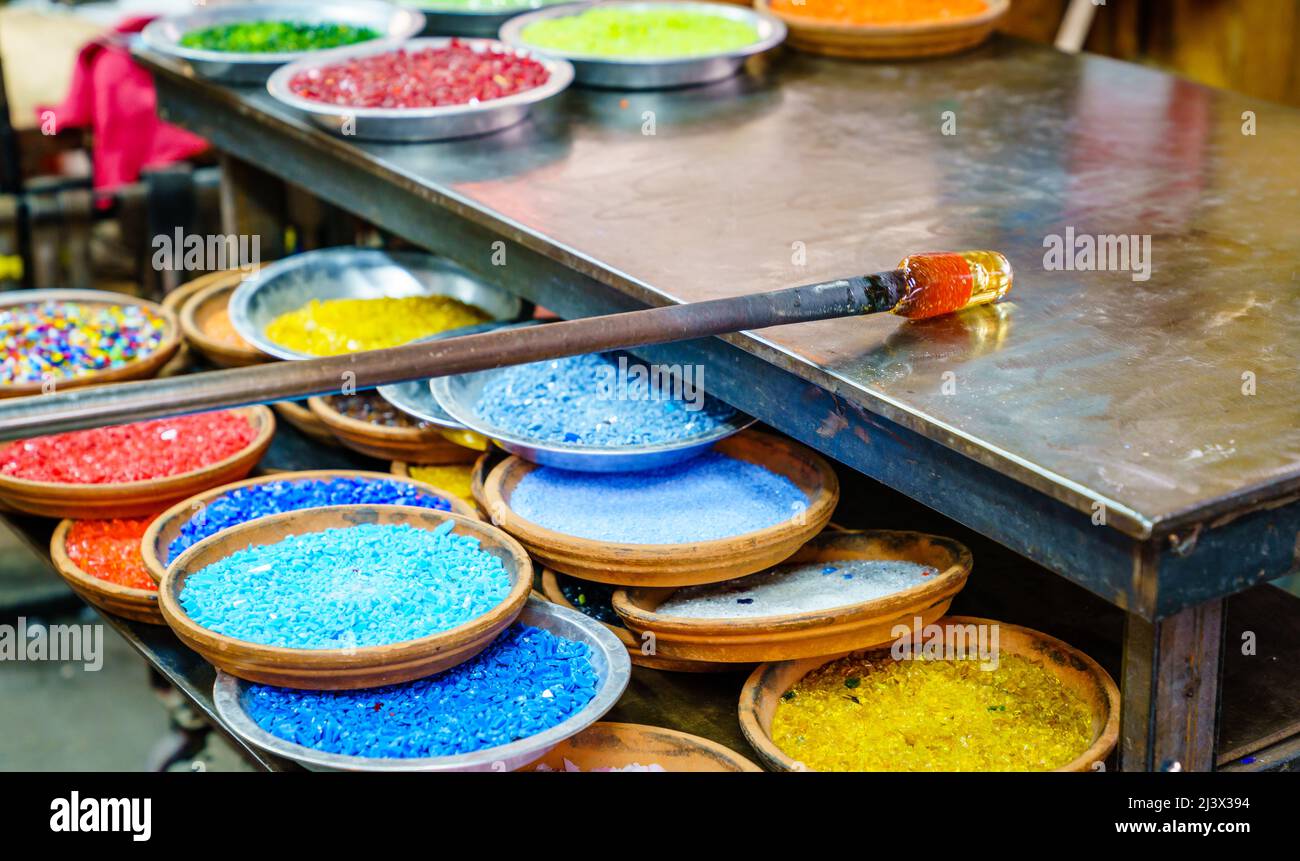 Colored glass frit used in glassblowing projects Stock Photo