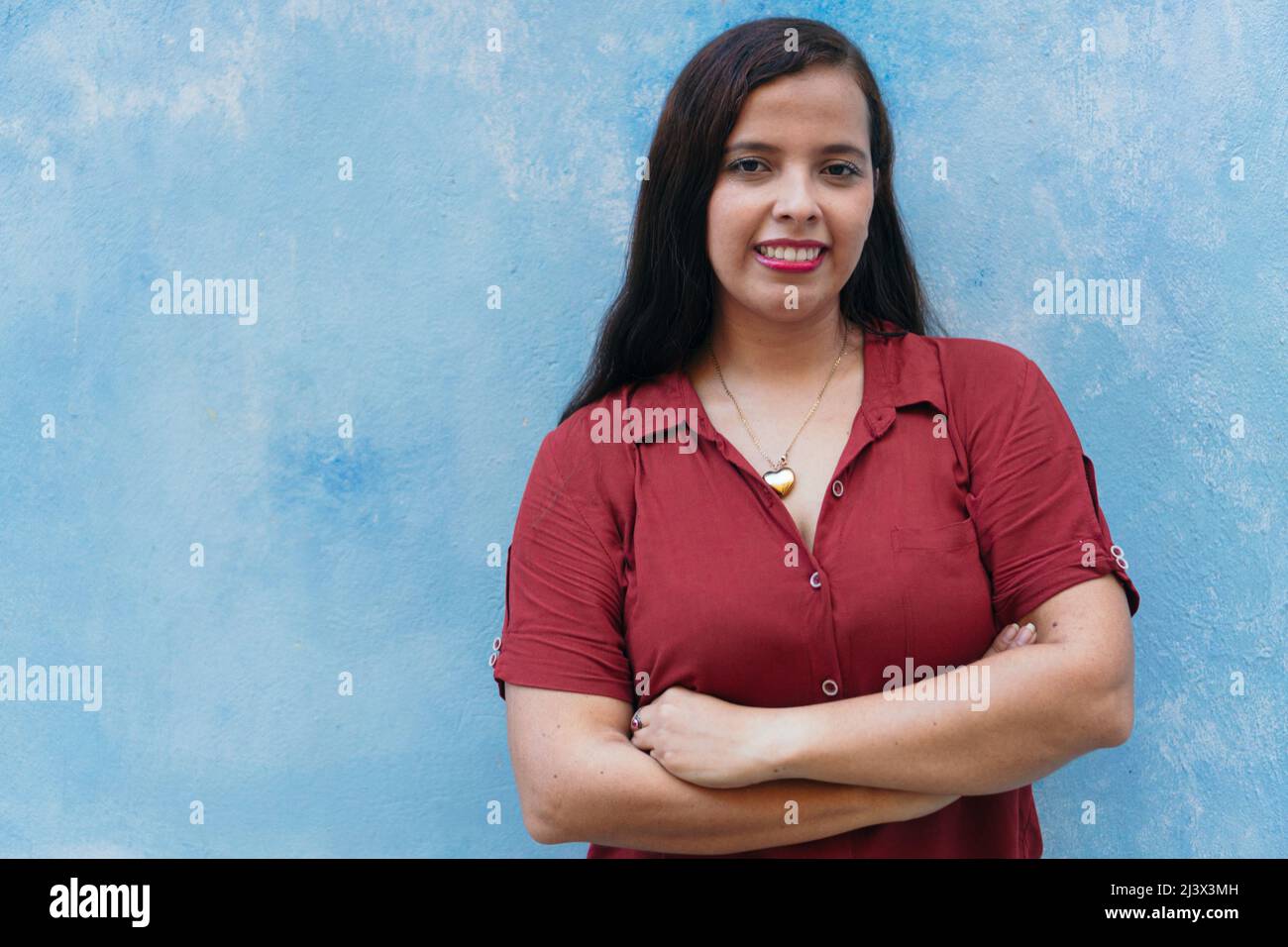 Young mixed race businesswoman smiling to camera Stock Photo