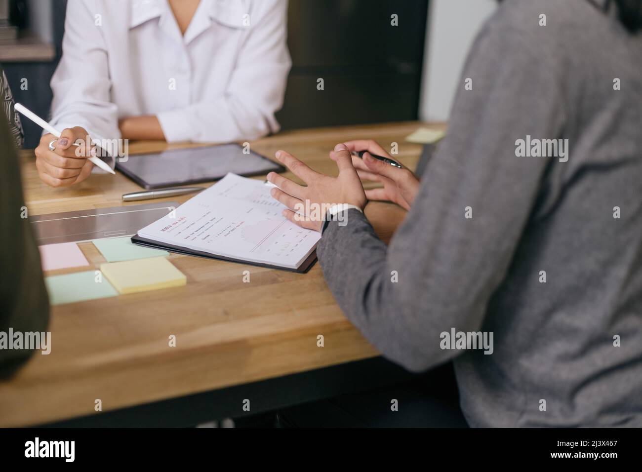 group of employees discussing a new business plan. close-up. Stock Photo